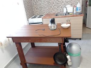 a wooden table in a kitchen with a sink at Vintage Mediterranean house in Himare +22 photos