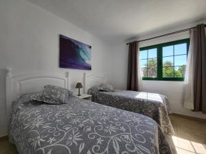 Posteľ alebo postele v izbe v ubytovaní Gueldera Apartments