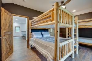 a bedroom with two bunk beds and a desk at Secluded Marathon Hideaway w/ Fire Pit + Views! in Marathon