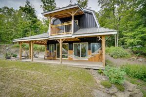 a house with a wrap around porch with a deck at Secluded Marathon Hideaway with Fire Pit and Views! in Marathon