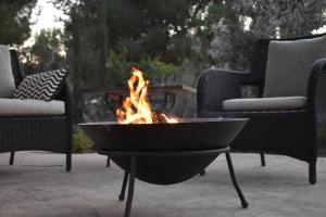 a fire pit sitting in the middle of a patio at Casa Encina in Murcia