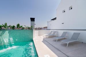 a swimming pool on the roof of a building at Stayaday Apartments Albufera in Madrid