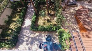 an overhead view of a yard with trees and a house at Apartment Villa for 6 person with garden in Golem