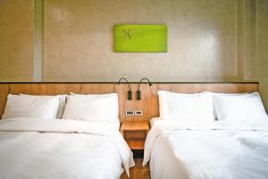 Postel nebo postele na pokoji v ubytování inami B&B