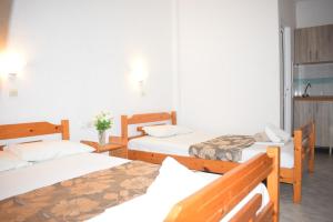 Postel nebo postele na pokoji v ubytování Hotel Katia