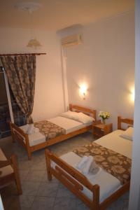 Postel nebo postele na pokoji v ubytování Hotel Katia