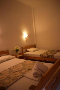 Postel nebo postele na pokoji v ubytování Hotel Katia