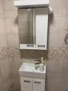 a bathroom with a sink and a mirror at Rajski Horizonti - Rooms Ram I in Ram