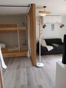Posteľ alebo postele v izbe v ubytovaní Studio Cabine RDC Pied des Pistes