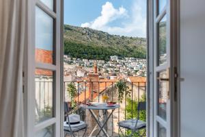 a window view of a city from a balcony at Shee-Lu Suites in Dubrovnik