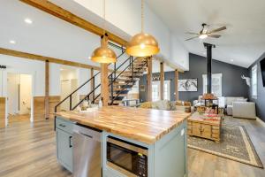 a kitchen and living room with wooden beams at Orangeville Vacation Rental with On-Site Creek! in Orangeville