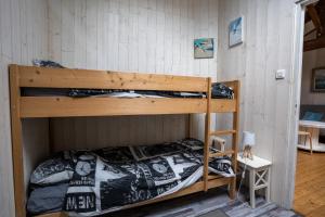 a bedroom with two bunk beds in a room at maison tartifume in Pornic