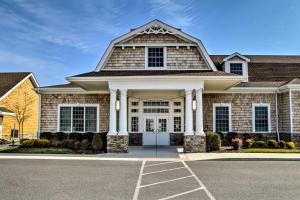 a brick house with a white front door at 3 Mi to Bethany Beach Ocean View Home with Patio in Clarksville