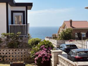 a house with a balcony with a view of the ocean at Villa Tarredonas - 12803 in Ajo