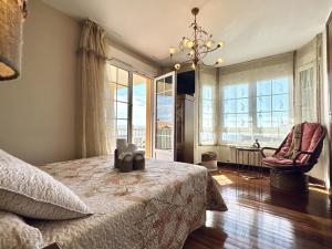 a bedroom with a bed and a large window at Villa Tarredonas - 12803 in Ajo