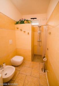 a bathroom with a toilet sink and a shower at Seconda stella a destra in Taranto