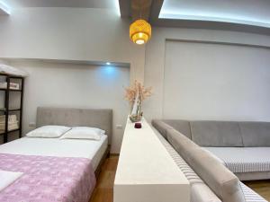 Postel nebo postele na pokoji v ubytování Areti Rooms Hotel