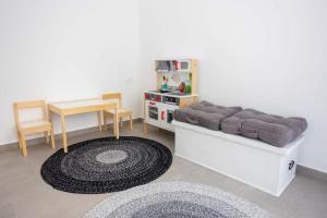 a living room with a couch and a table at Beachfront Villa Sol&Mar with heated pool and jacuzzi in Kaštela