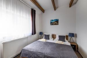 Postel nebo postele na pokoji v ubytování Apartments Čerešňový Sad & Wellness