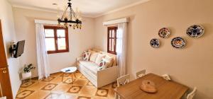 a living room with a table and a couch at Kyano seaview in Olympos