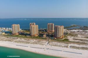 an aerial view of a beach with tall buildings at Amazing WATERVIEW in every room, PORTOFINO Island Resort condo in Pensacola Beach