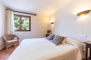 Posteľ alebo postele v izbe v ubytovaní Finca Cas Contador Mallorca