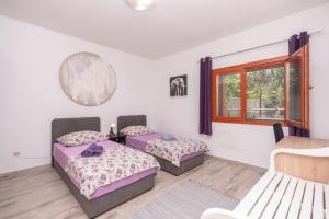 Postel nebo postele na pokoji v ubytování Villa Lino + 18 fotografií