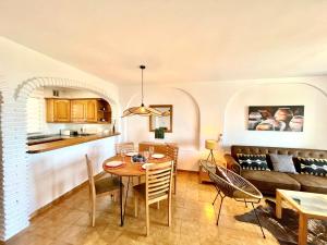 a dining room and kitchen with a table and chairs at Paradise in Riviera by the Sea in Mijas