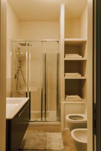 a bathroom with a shower and a toilet and a sink at Firenze House Zanella in Florence
