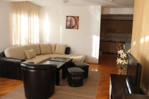 a living room with a couch and a table at Vila Kumani in Ohrid