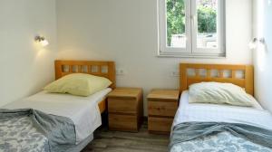 Postel nebo postele na pokoji v ubytování Apartment Daca