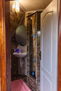 a bathroom with a sink and a mirror at Guest house Al Meri in Travnik