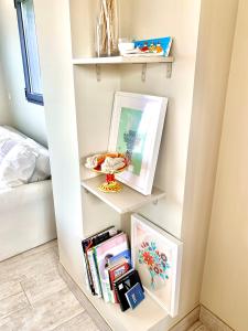 a shelf in a bedroom with books at Breathtaking views to Ría de Arosa in Vilagarcia de Arousa