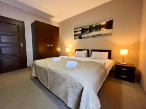 Postel nebo postele na pokoji v ubytování Willa Port Apartament