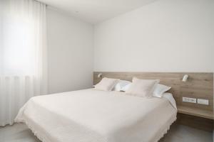 Postel nebo postele na pokoji v ubytování Villa Bianca Vodice