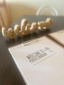 a table with a document with a necklace on it at Precioso apartamento en primera línea de playa in San Blas