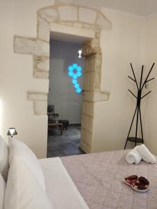 a bedroom with a bed and blue balloons on the wall at Arcade City Apartment in Rethymno