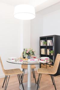 a dining room with a table and chairs at SlowHome Catedral in Almería