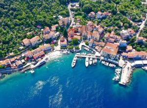 an aerial view of a harbor with boats in the water at Apartments Nevija in Valun