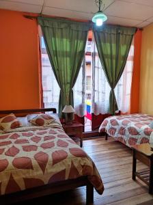Postel nebo postele na pokoji v ubytování La Posada Colonial