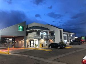 a gas station with a car parked in a parking lot at Quality Inn Santa Fe New Mexico in Santa Fe