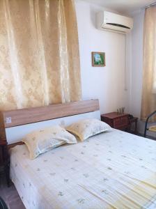 Postel nebo postele na pokoji v ubytování Kiki - family apartment