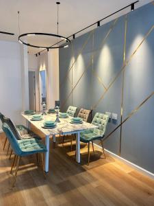 a dining room with a table and chairs at panoramic apartment EdenTower in Bat Yam