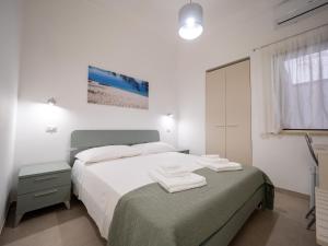 Postel nebo postele na pokoji v ubytování Torre del Salento