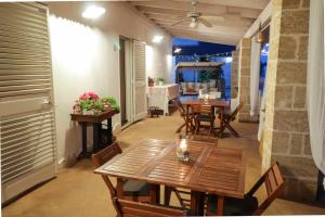 a dining room with wooden tables and chairs at santa potenza in Felline