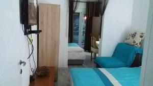 a room with a bed and a chair and a window at Apartment’s Maric - Zelenika,Herceg Novi in Zelenika