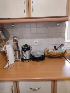 a kitchen counter top with a sink and a counter top at Mixaleas apartments in Kalamata