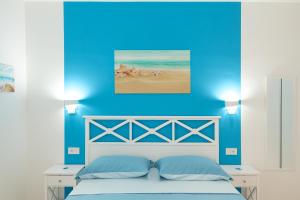 Ένα ή περισσότερα κρεβάτια σε δωμάτιο στο Private room and pool in the beach free wi-fi
