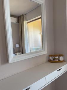 a mirror sitting on a shelf in a room at Cabacum Beach Residence AP.19 in Varna City