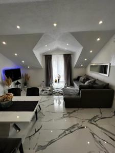 a large living room with a large marble floor at Luxury Apartment Megy in Otočac